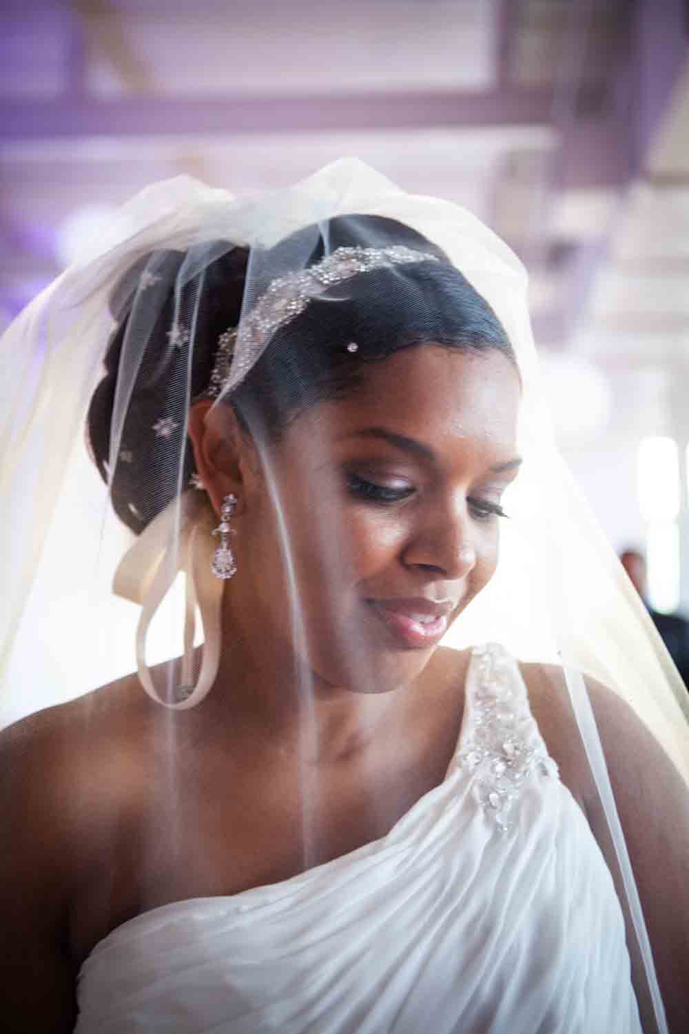 Portrait of bride wearing veil at an Attic Studios wedding