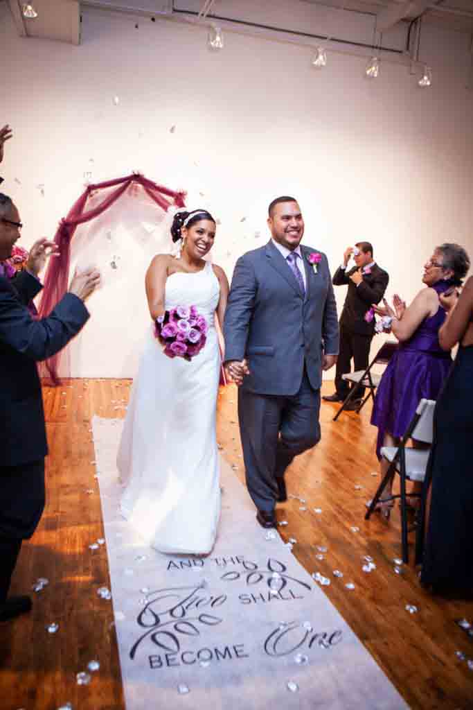 Bride and groom walking down aisle after Attic Studios ceremony