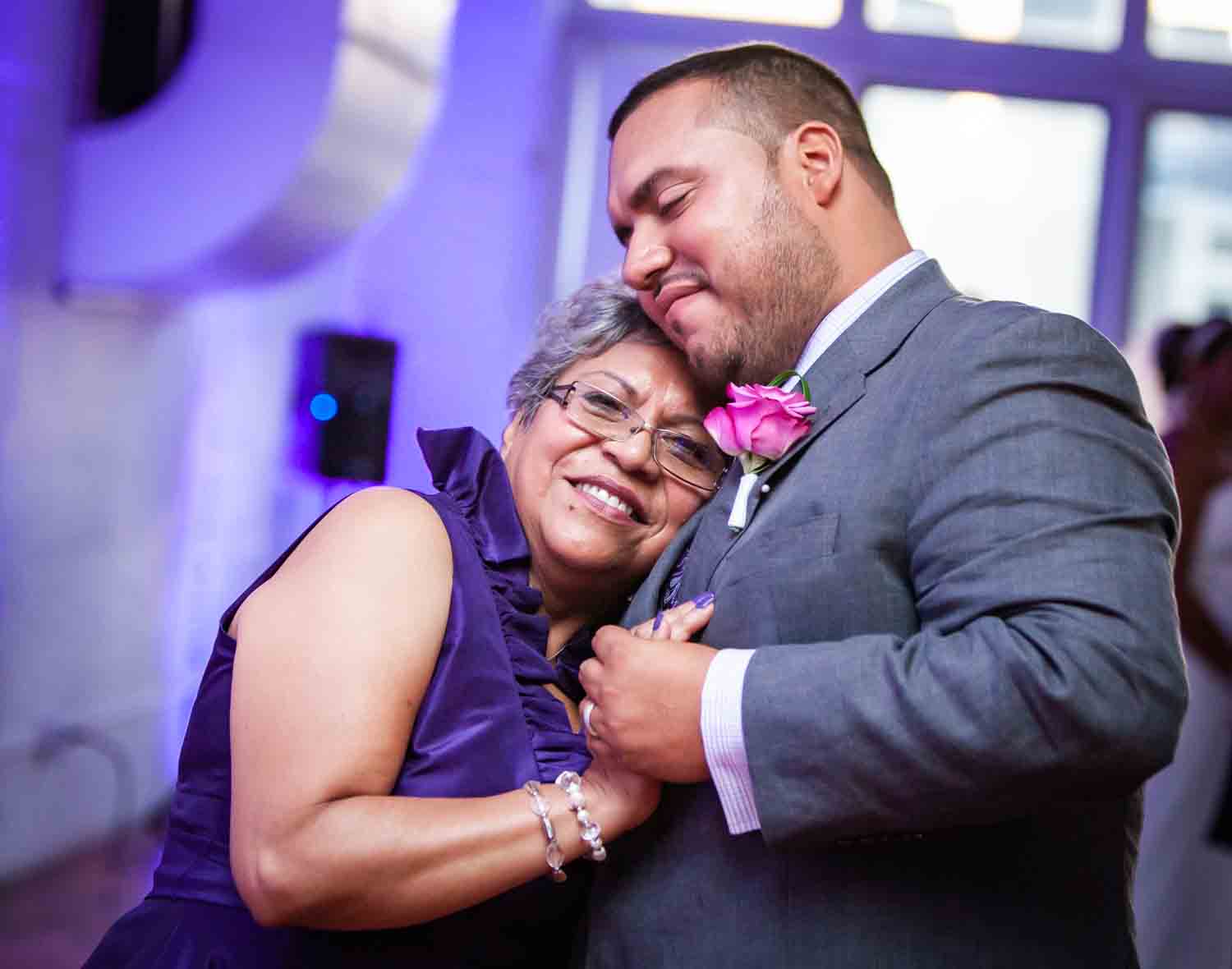 Groom dancing with mother at an Attic Studios wedding