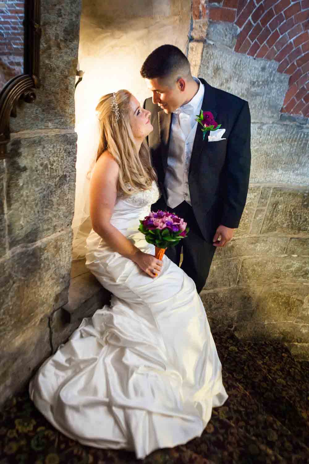 Bride and groom in the stairwell of the Fort Hamilton Community Center