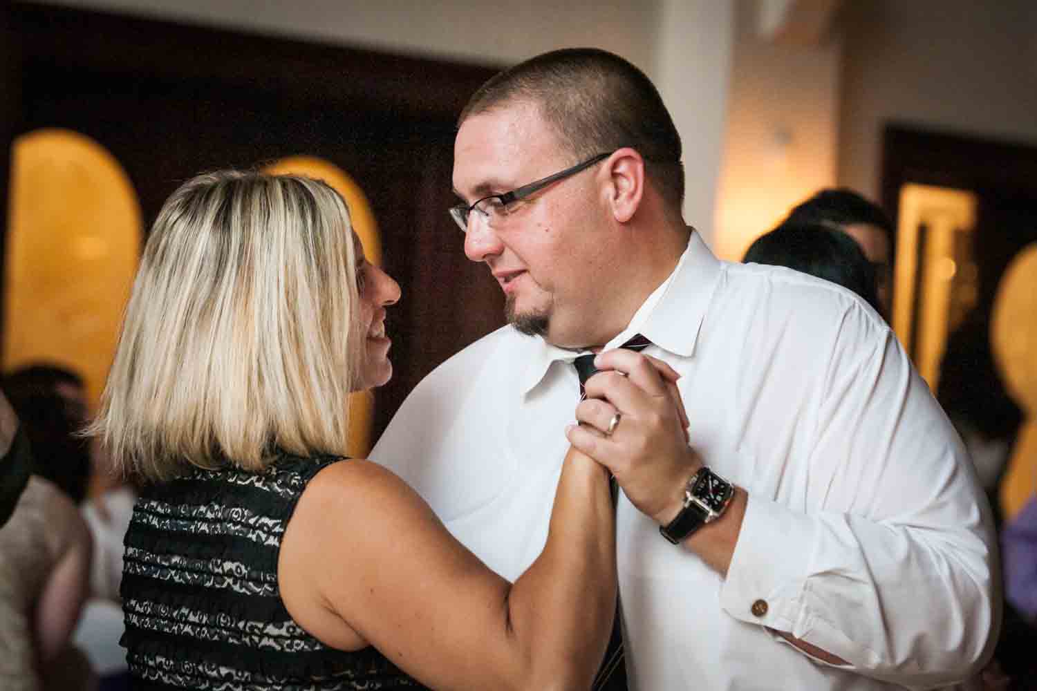 Couple dancing close at a Fort Hamilton Community Center wedding