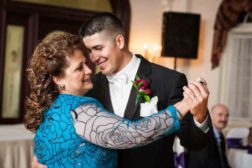 Groom dancing with mother at a Fort Hamilton Community Center wedding