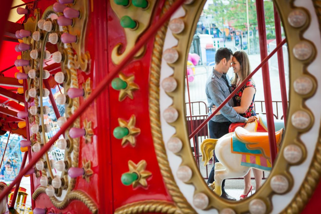 Reflection of couple in carousel mirror