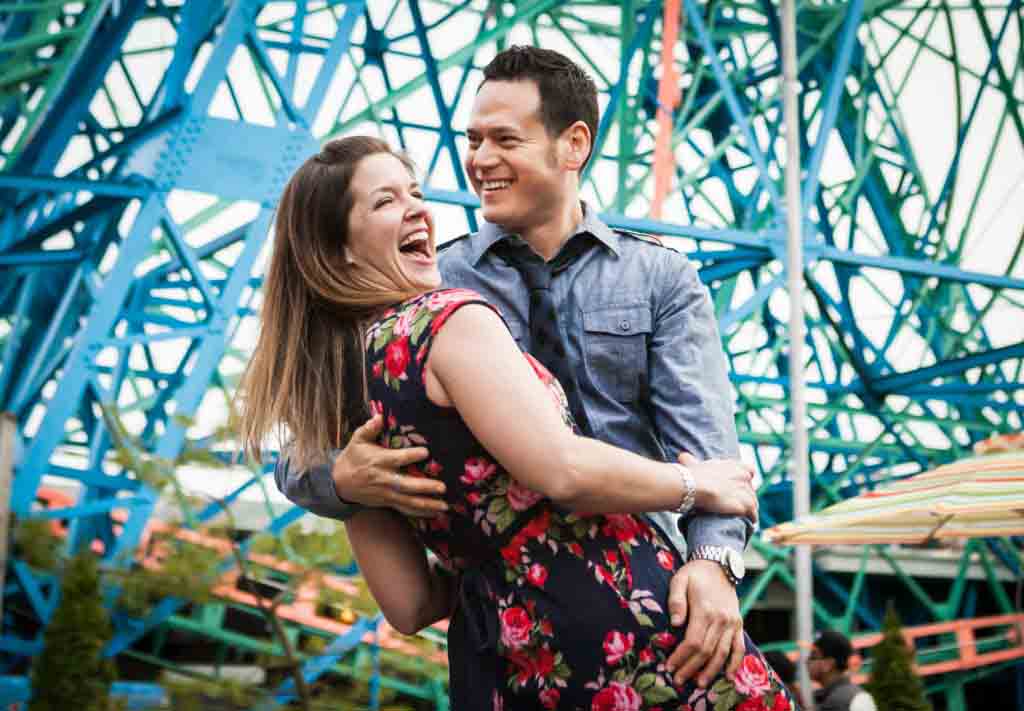 Couple dancing underneath Wonder Wheel at Coney Island
