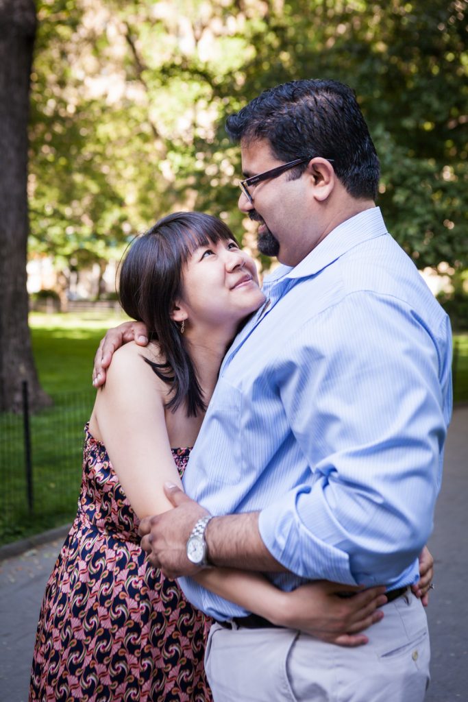 Couple hugging during a Madison Square Park engagement session
