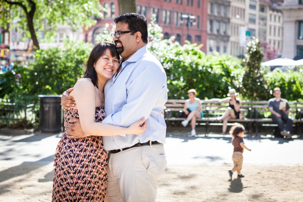 Couple hugging during a Madison Square Park engagement session