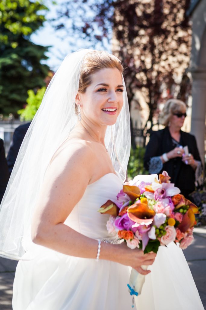 Bride wearing veil and bouquet after a Ravel Hotel Penthouse wedding