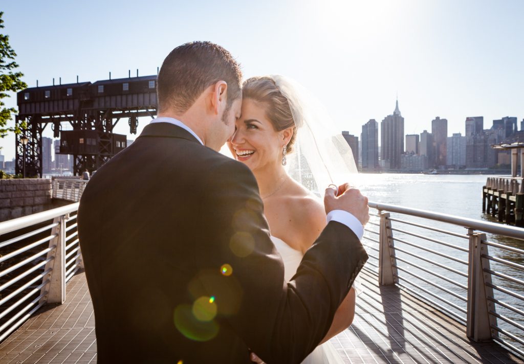 Bride and groom in Gantry Plaza State Park before a Ravel Hotel Penthouse wedding