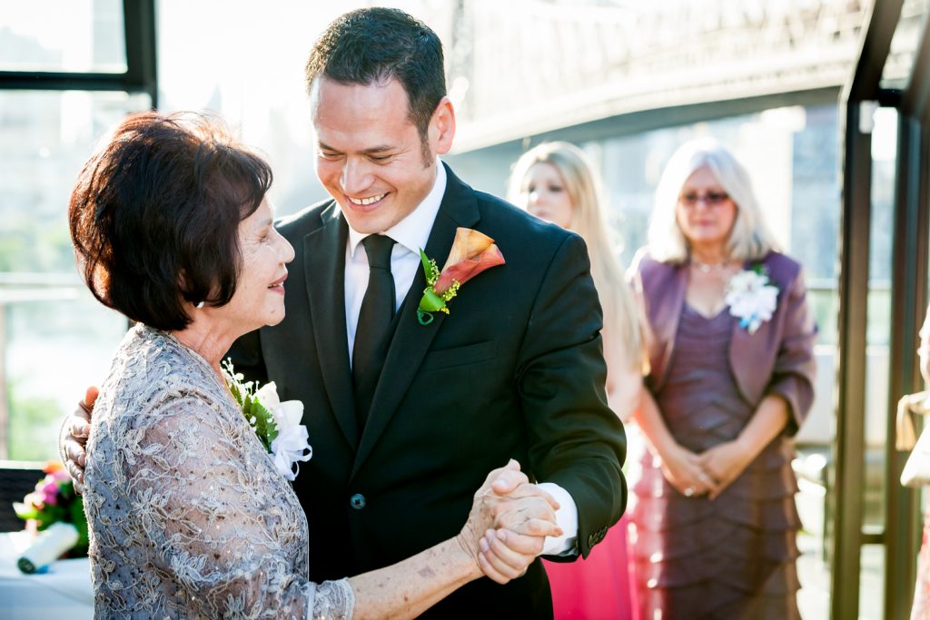 Mother-son dance at a Ravel Hotel Penthouse wedding
