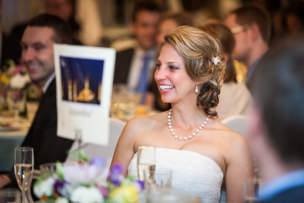 Bride laughing at speeches at a Davenport Mansion wedding