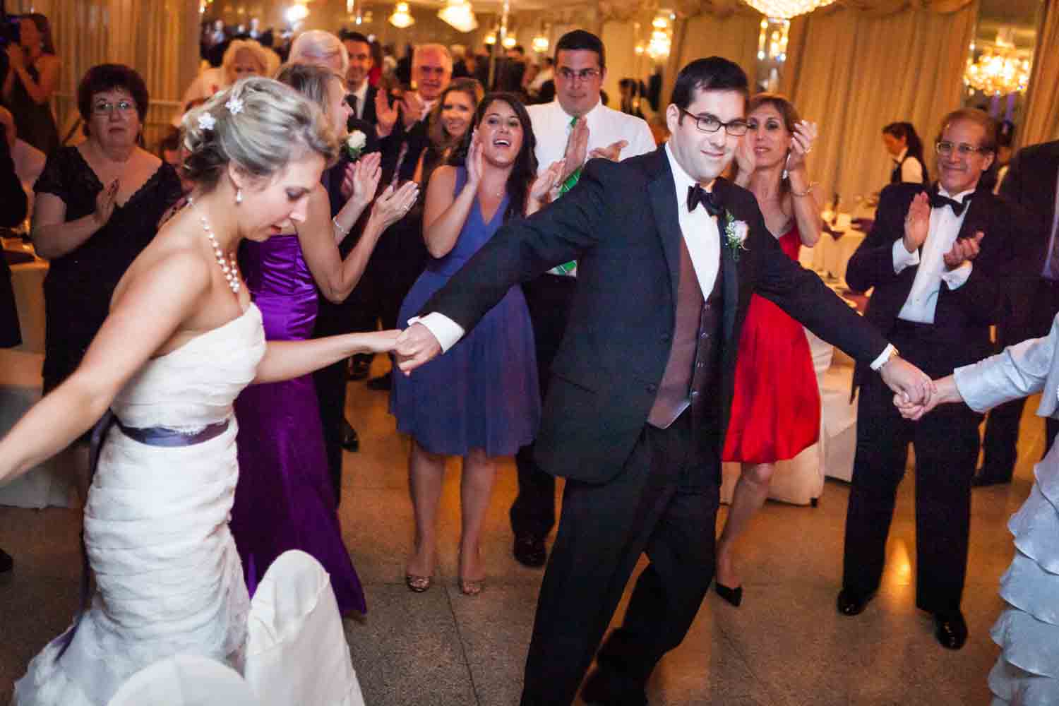 Bride and groom dancing in circle at a Davenport Mansion wedding