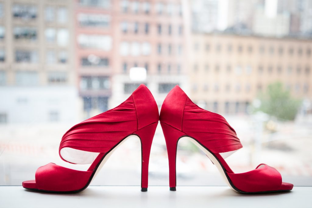 Red high heels in windowsill for a Merchant's House Museum wedding