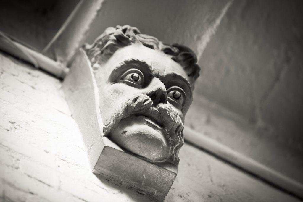 Black and white photo of Teddy Roosevelt wall decoration at the Alger House