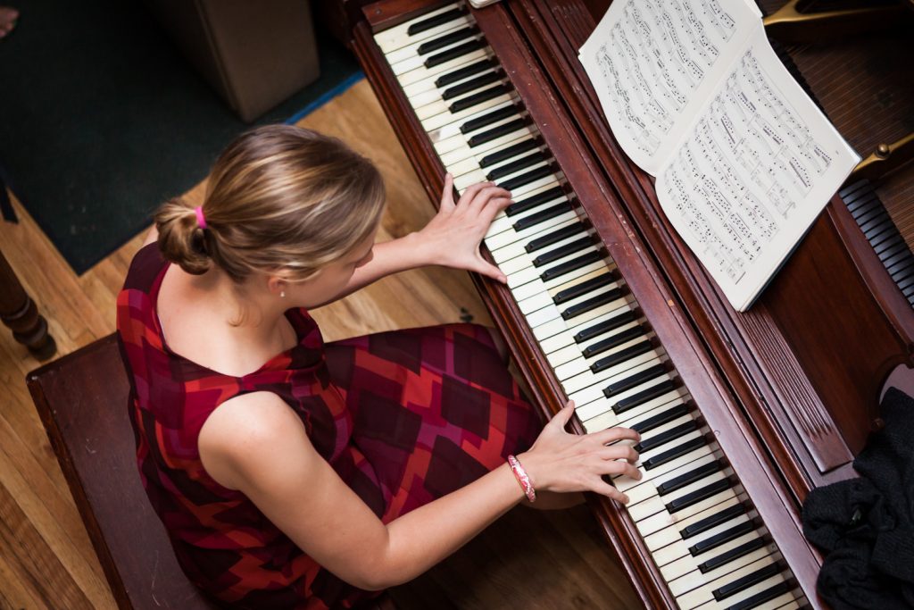 View overhead of woman playing piano