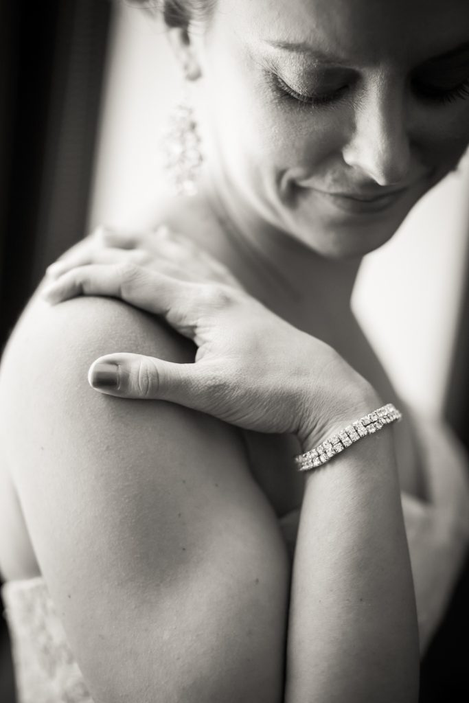 Black and white photo of bride with diamond earring