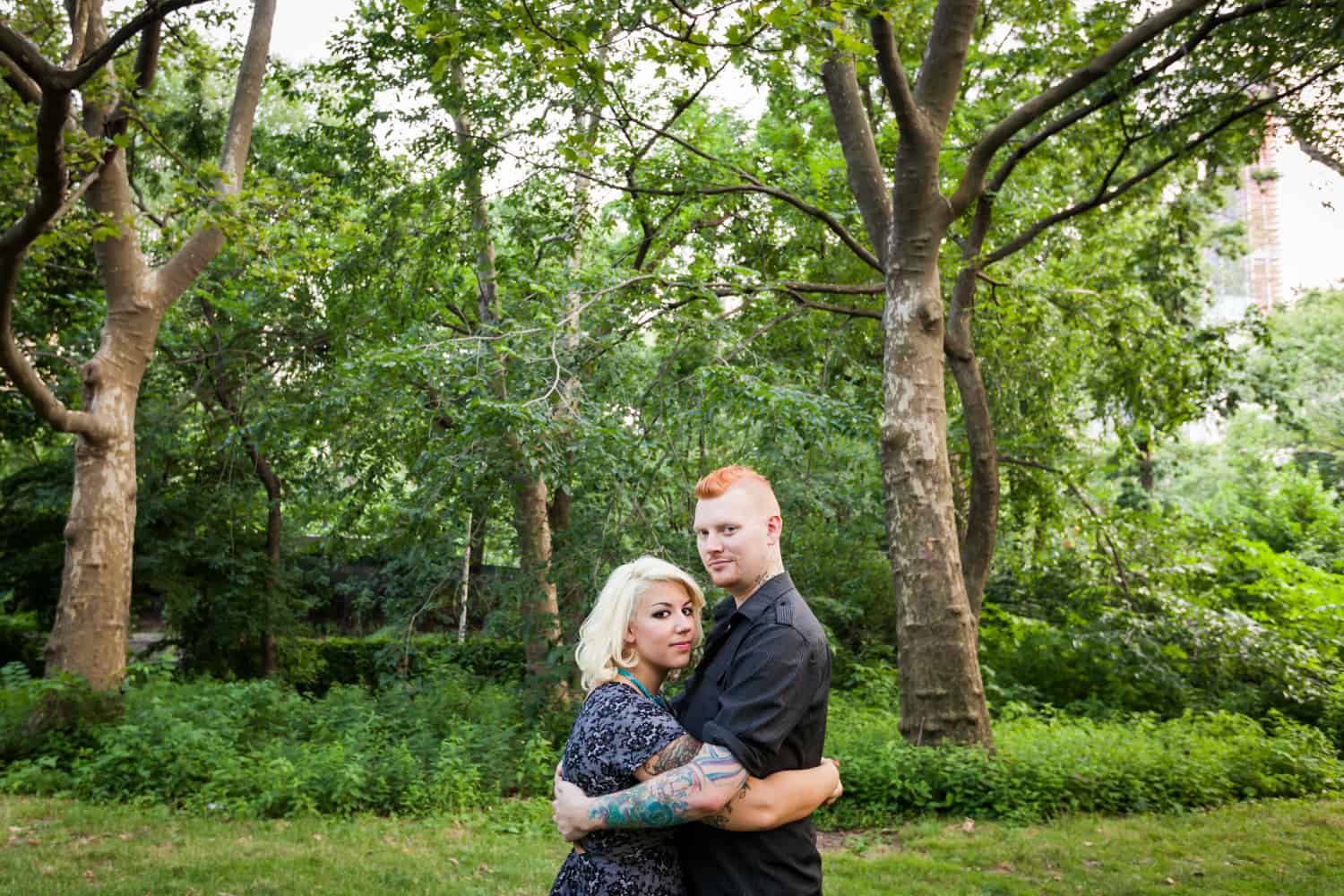 Central Park engagement photos of couple hugging