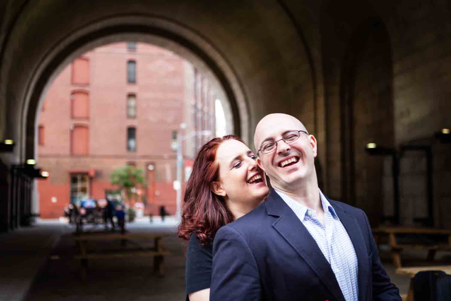 Couple in front of DUMBO Archway