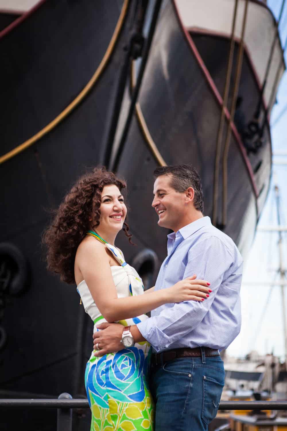 Financial District engagement photos of couple in front of ship