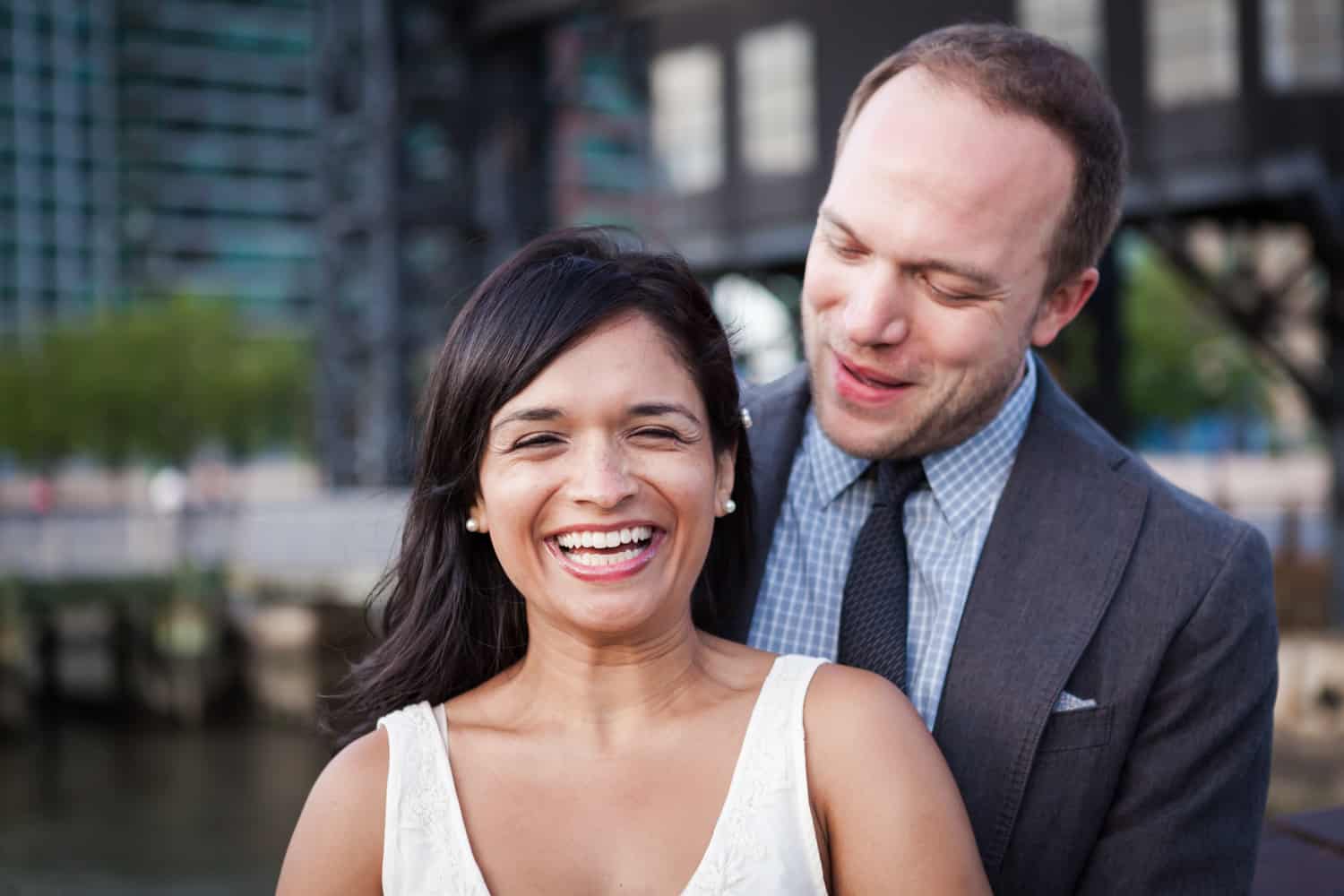 Couple laughing during a Gantry Plaza State Park engagement shoot