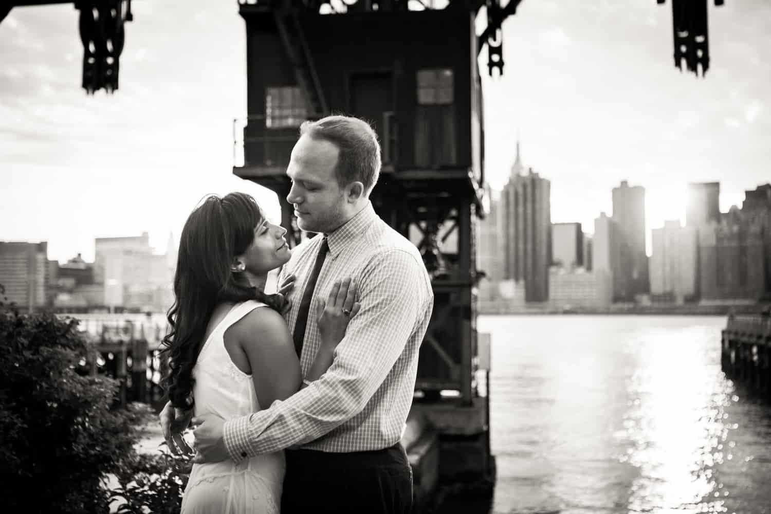 Black and white photo of couple hugging during Gantry Plaza State Park engagement shoot