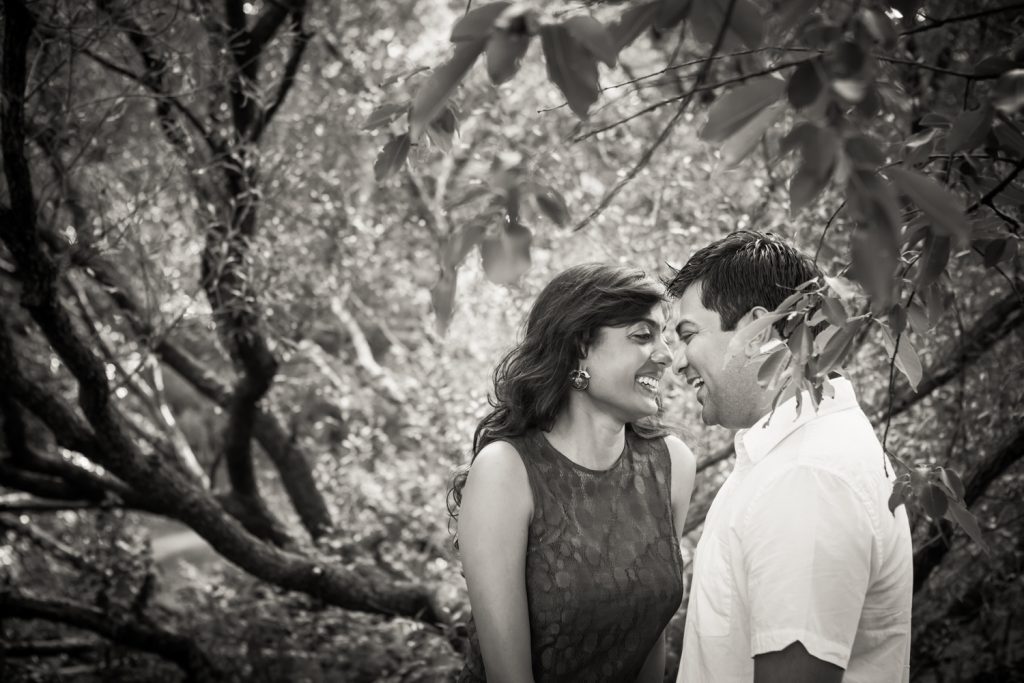 Black and white photo of couple in forest