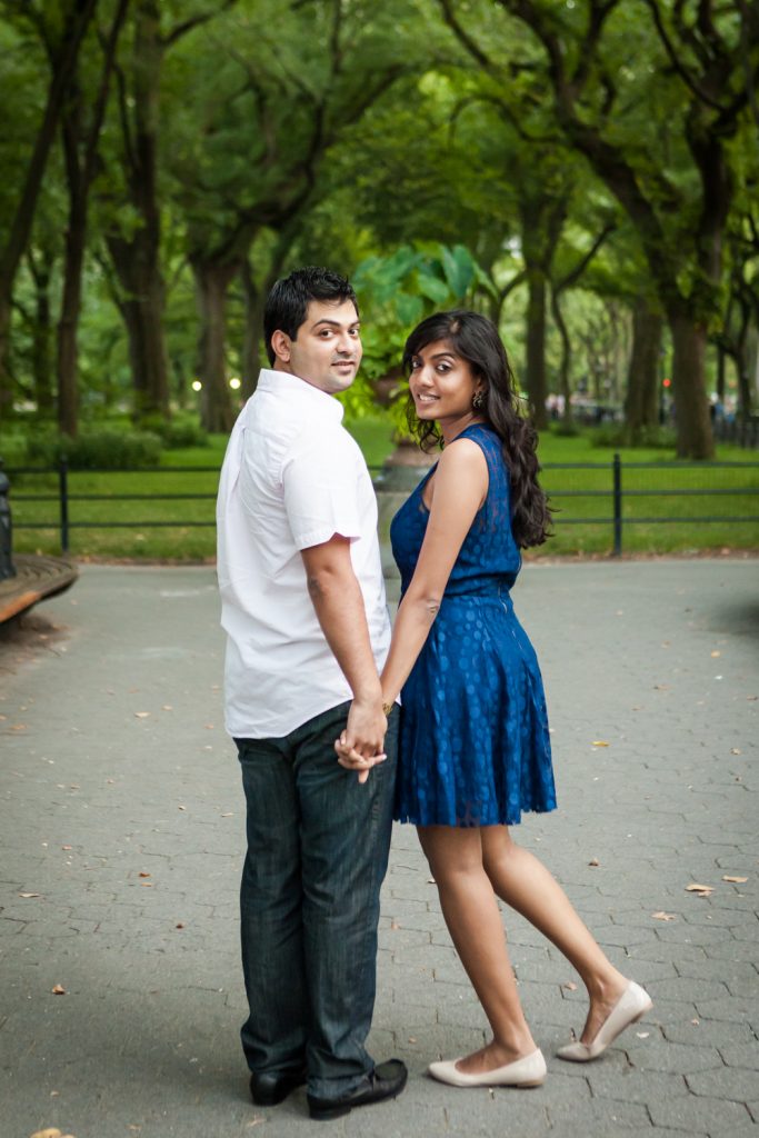 Couple holding hands and walking on the Mall in Central Park