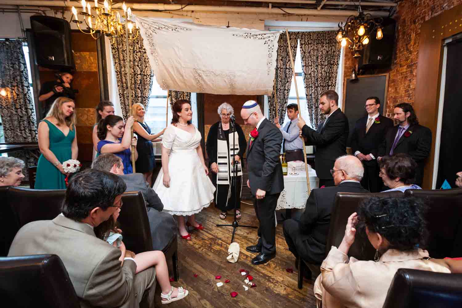 Jewish wedding ceremony with groom about to step on glass at a DUMBO wedding