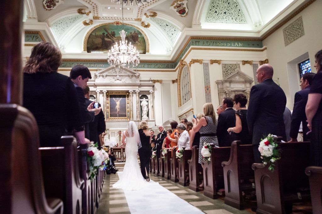 Bride and groom walking up aisle at St. Peter's Church wedding ceremony