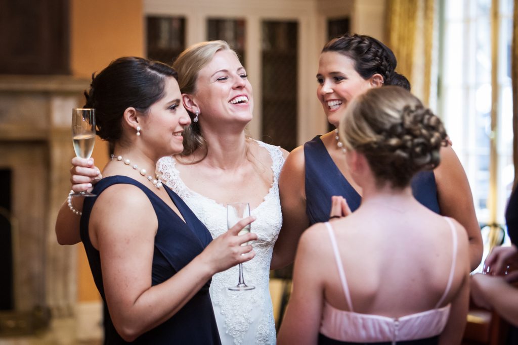 Bride talking with girlfriends during cocktail hour at a Harvard Club NYC wedding