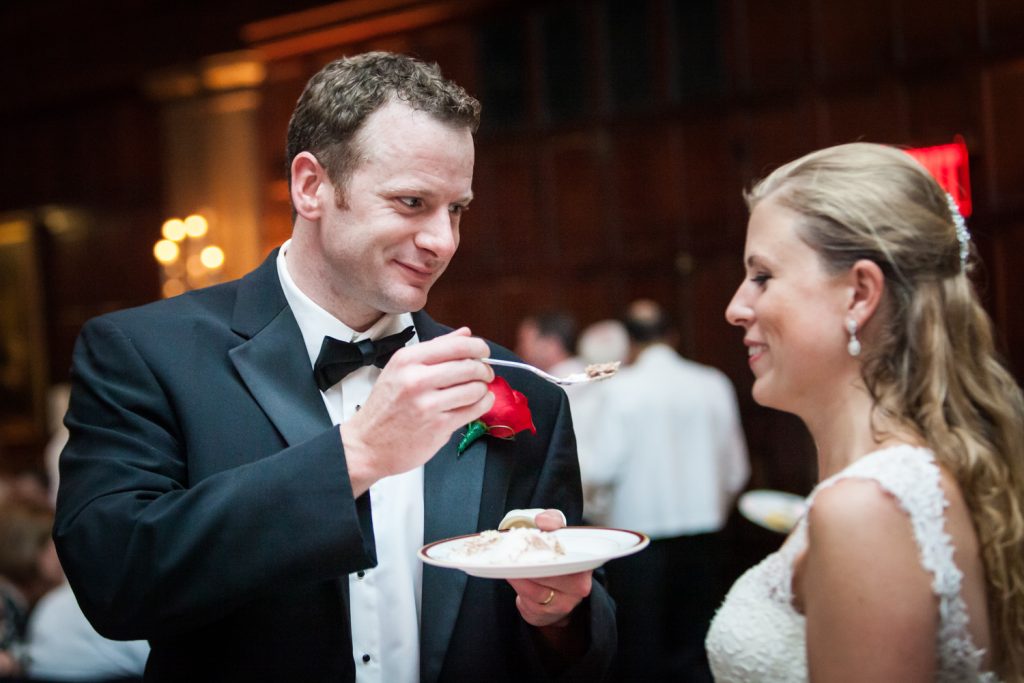 Groom feeding cake to bride at a Harvard Club NYC wedding