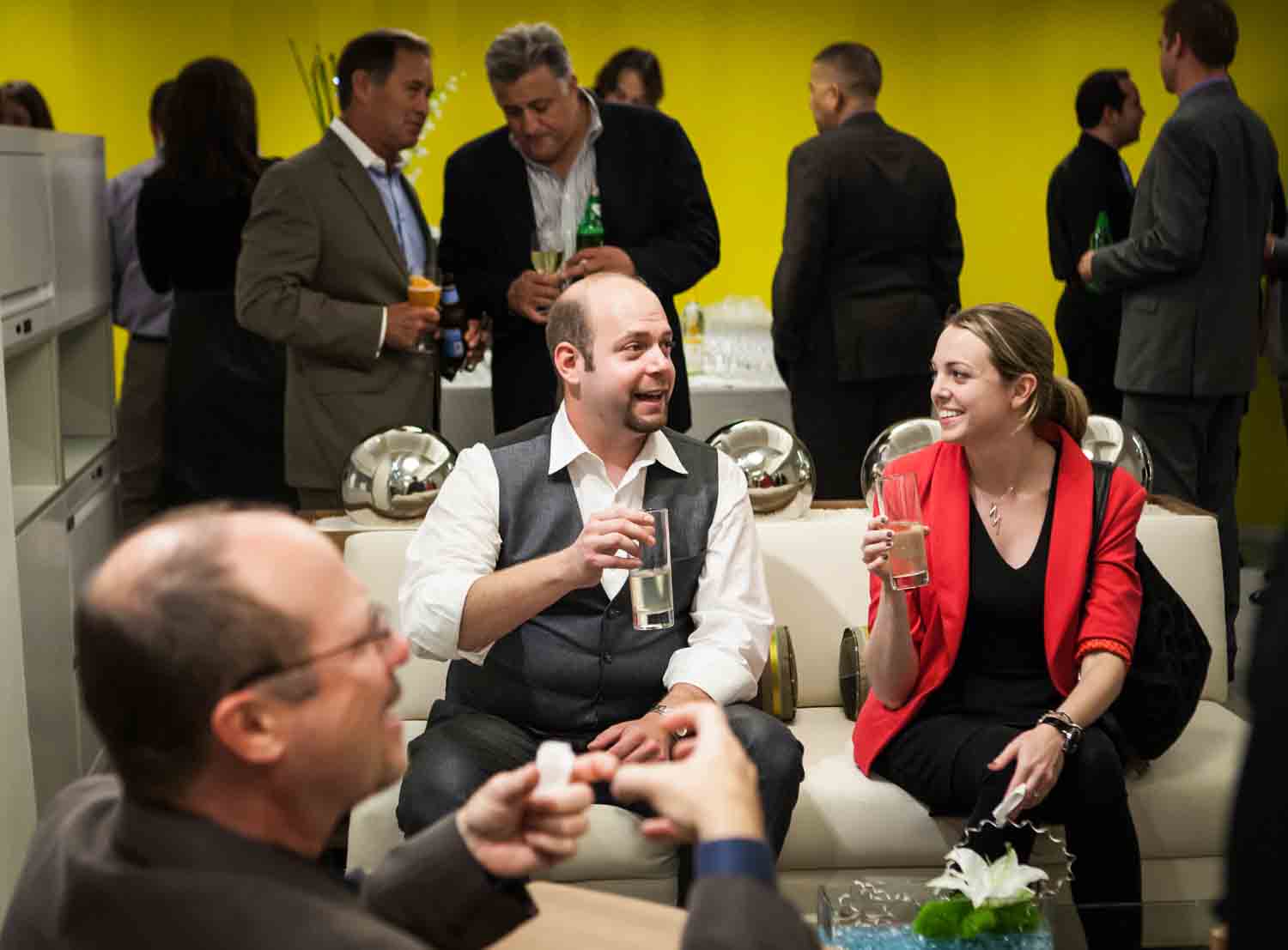 Guests talking at a corporate cocktail party for an article on corporate event planning tips