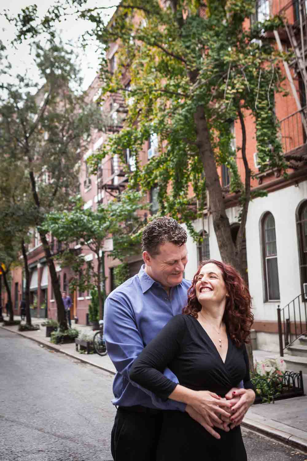 High Line engagement photos of couple in front of Greenwich Village brownstones