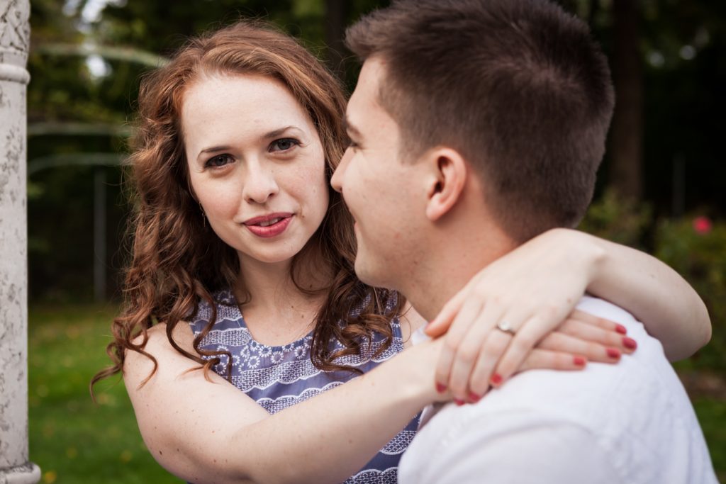 Woman hugging man at a Lyndhurst Mansion engagement photoshoot