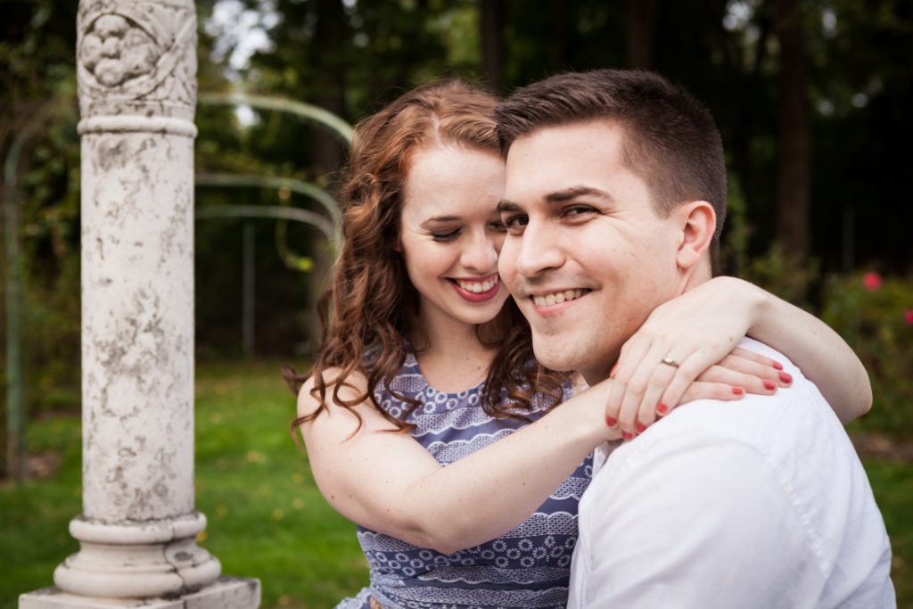 Couple hugging at a Lyndhurst Mansion engagement photoshoot