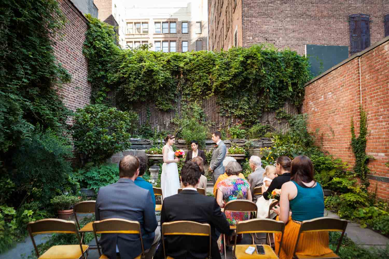Merchant's House Museum wedding photos of ceremony in walled garden
