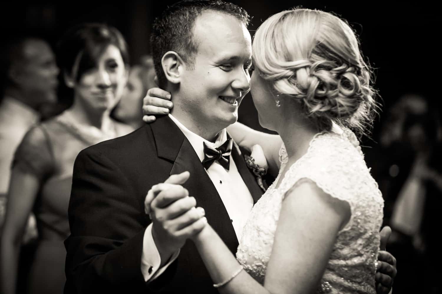 Black and white photo of bride and groom during first dance