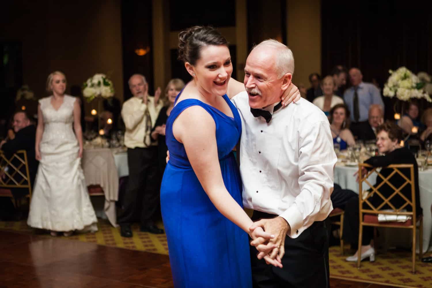 Father dancing with bridesmaid at a Nicotra's Ballroom wedding