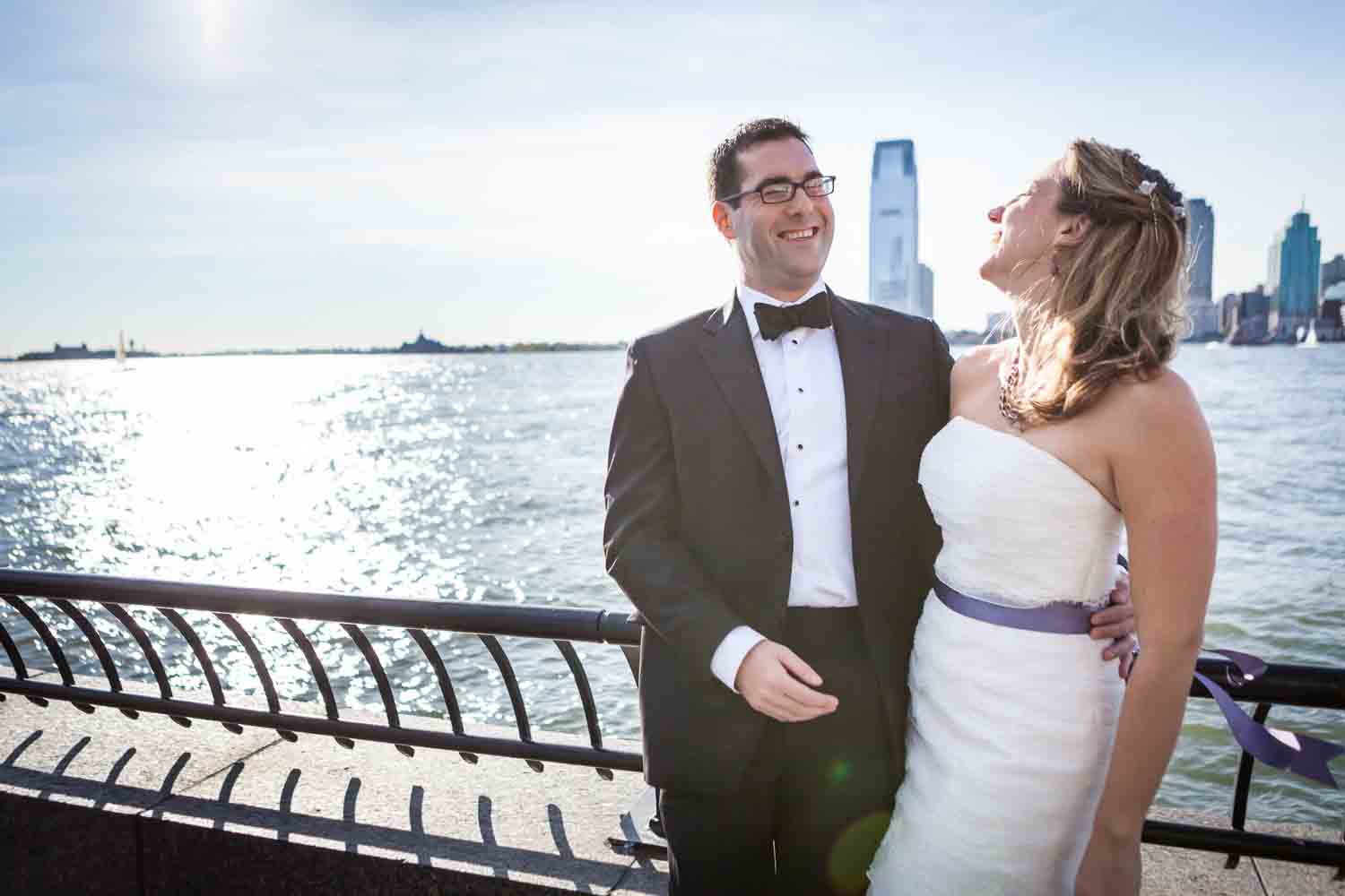 Bride and groom in front of Hudson River waterfront at a trash the dress shoot