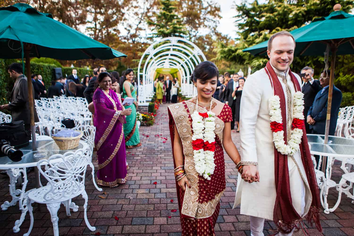 Bride and groom recessing after traditional Hindu wedding ceremony at an East Wind Inn wedding