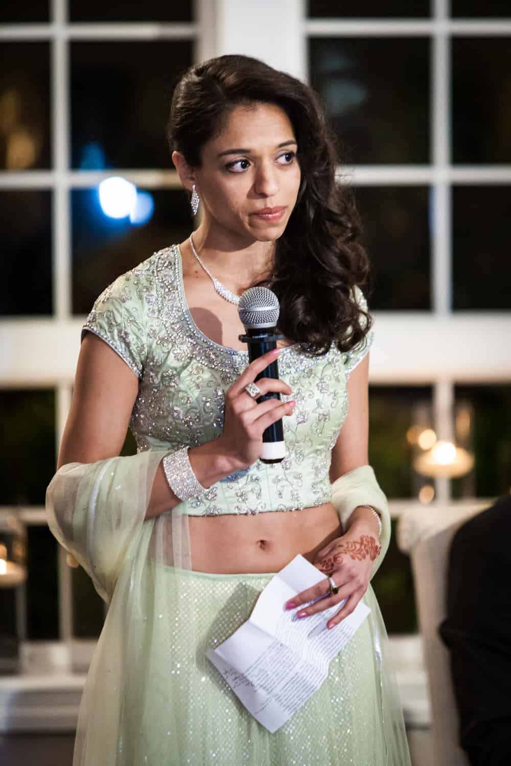 Maid of honor making speech in Indian traditional sari at an East Wind Inn wedding reception