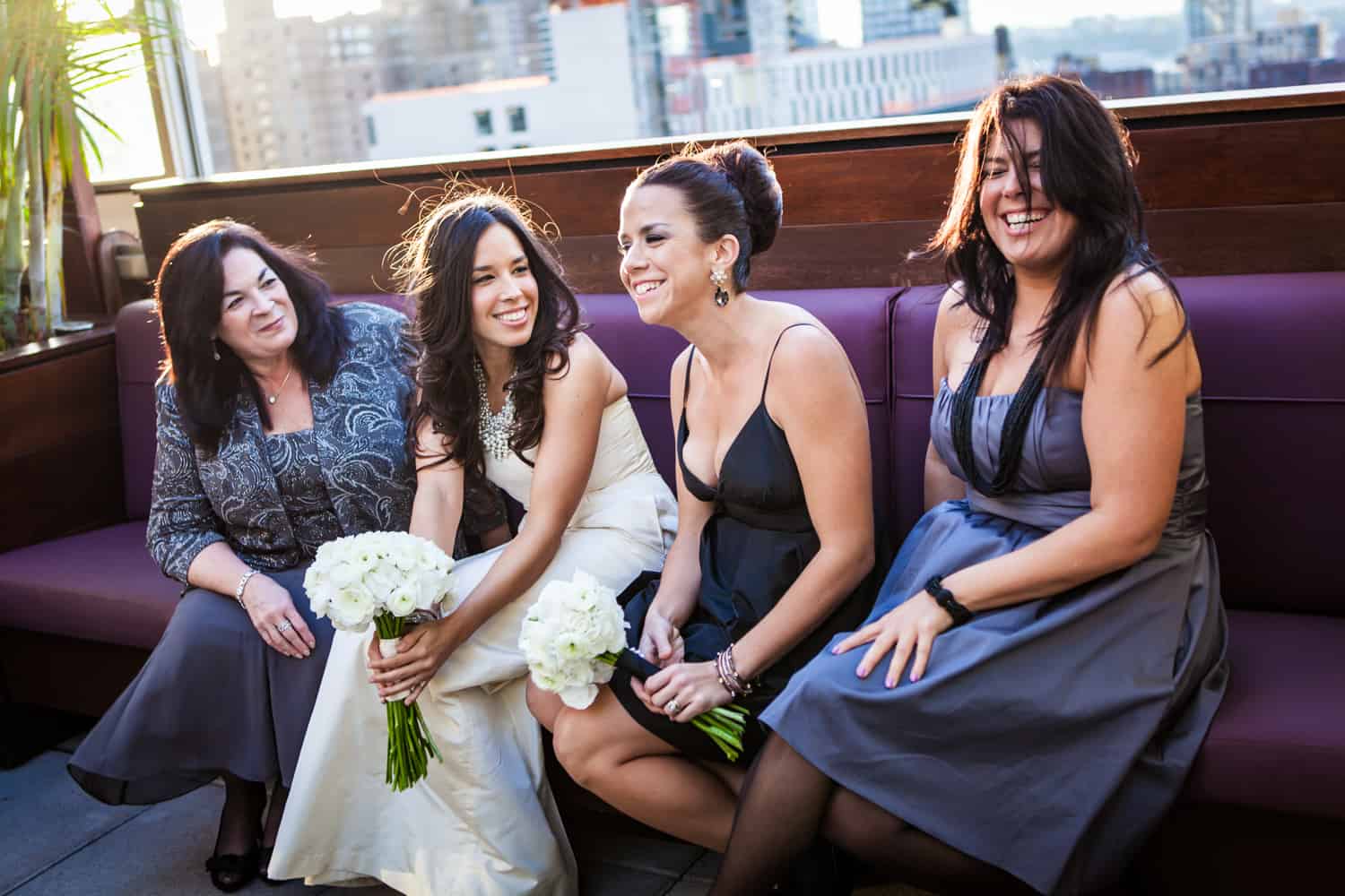 Bride and bridesmaids before Empire Hotel rooftop wedding