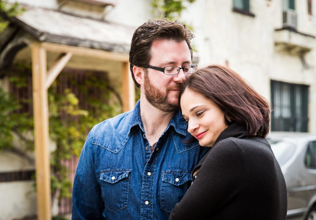 Couple standing in middle of Washington Mews during a Greenwich Village engagement session
