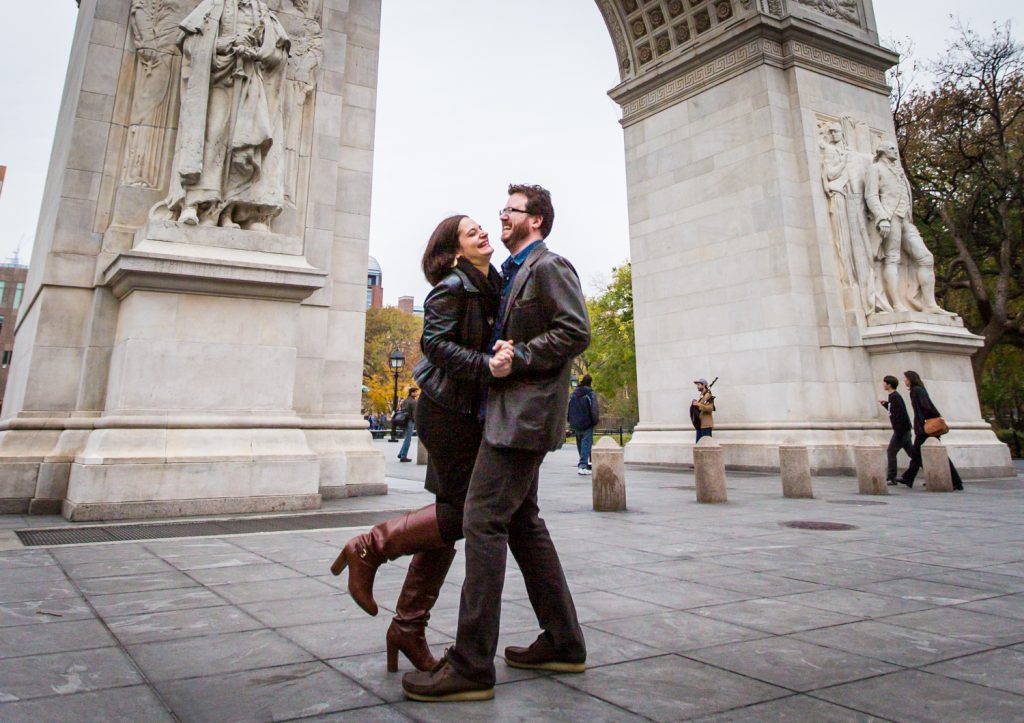 Couple dancing in front of Washington Square Arch during a Greenwich Village engagement session