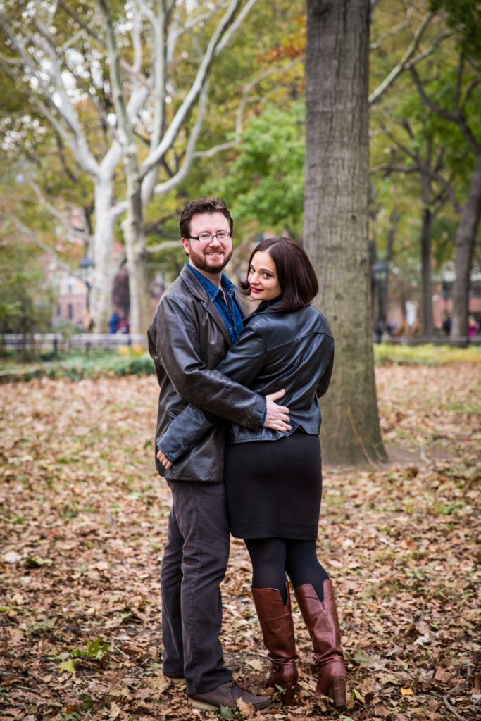 Couple walking in Washington Square Park during a Greenwich Village engagement session