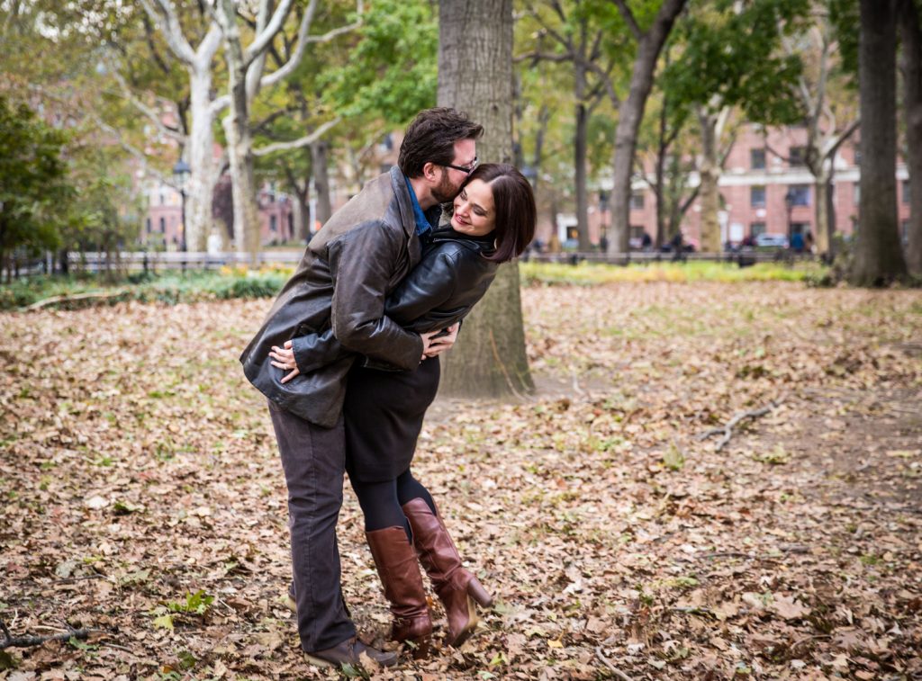 Couple hugging in Washington Square Park during a Greenwich Village engagement session