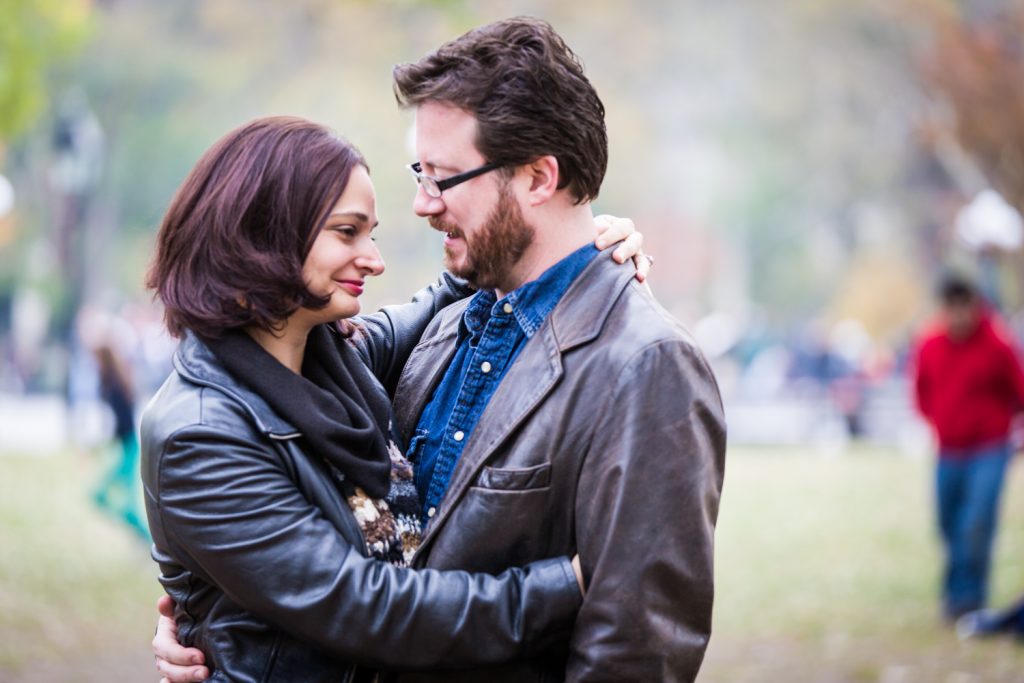 Couple hugging in Washington Square Park during a Greenwich Village engagement session