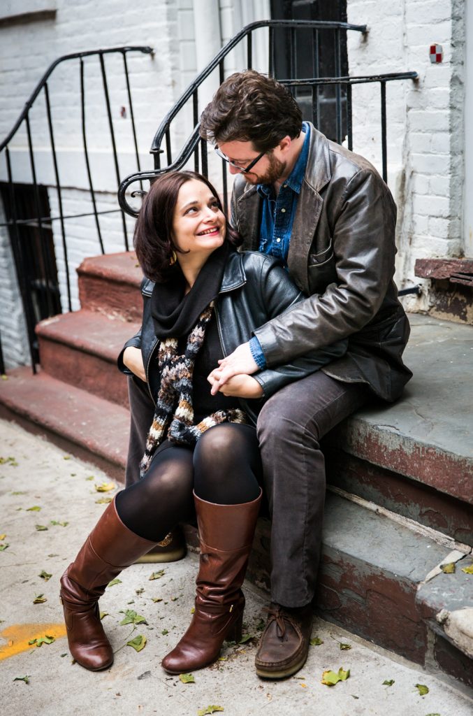 Couple sitting on steps in Greenwich Village