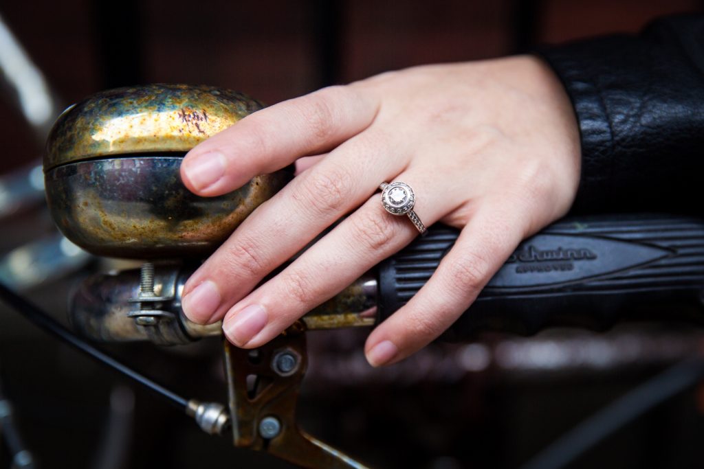 Close up on woman's hand wearing engagement ring
