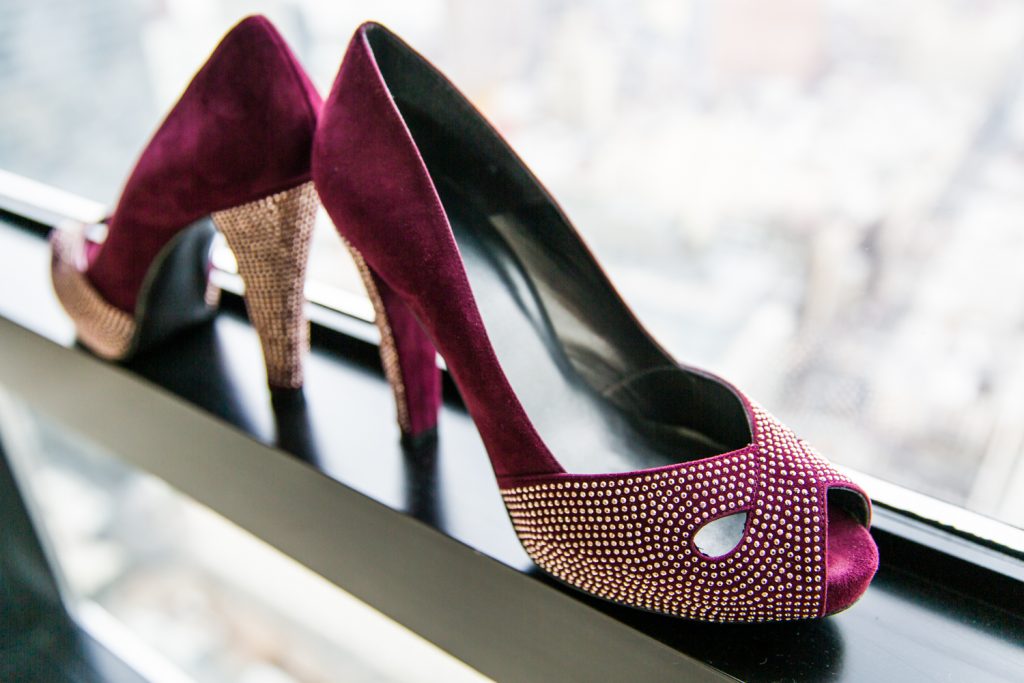 Maroon heels perched on a windowsill for a Locanda Verde wedding