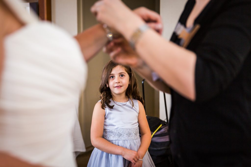 Little girl watching bride get ready for a Locanda Verde wedding